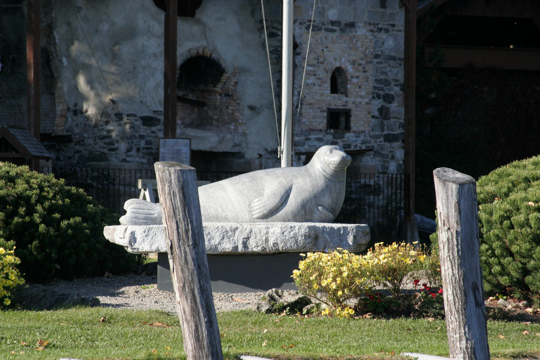 The limestone statue of André the seal on a granite base in Rockport, Maine
